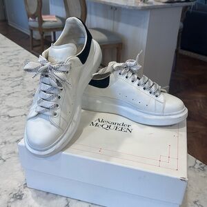 Size 9B Alexander McQueen white with black suede detail platform sneakers.